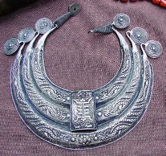 This photo of ethnic jewelry, specifically a Miao Collar, was provided courtesy of the artist: "Vassil".  The Miao people are one of China's ancient tribes.