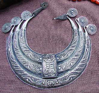 This photo of ethnic jewelry, specifically a Miao Collar, was provided courtesy of the artist: "Vassil". The Miao people are one of China's ancient tribes.